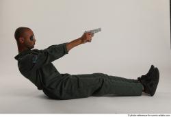 Man Adult Average Black Fighting with gun Sitting poses Casual